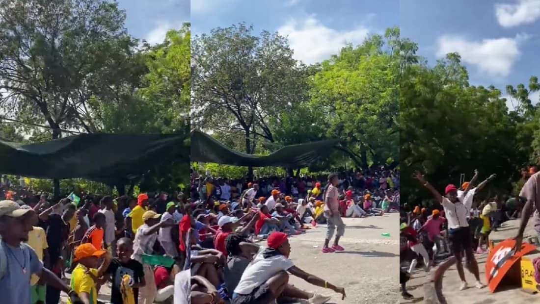 Pessoas reunidas no Haiti celebrando a vitória do Brasil contra a Suíça