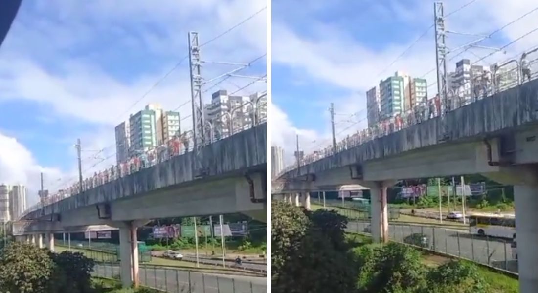 Passageiros andam pelos trilhos após apagão afetar metrô em Salvador