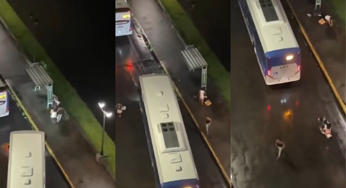 Vídeo captou o momento em que a mulher é abordada por dois homens que a empurram para tomar seus pertences