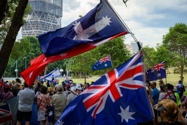 Australianos prestam homenagem a vítimas de ataque em Sidney. | Foto: George Chan/AFP